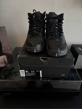 Jordan 12s Kids Black with Gold Accent High-Top Athletic Shoes